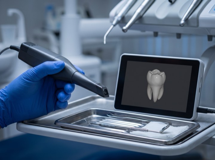 An intraoral scanner on its stand