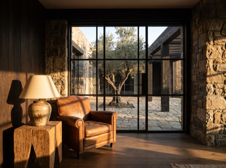The lounge: one armchair by a courtyard window