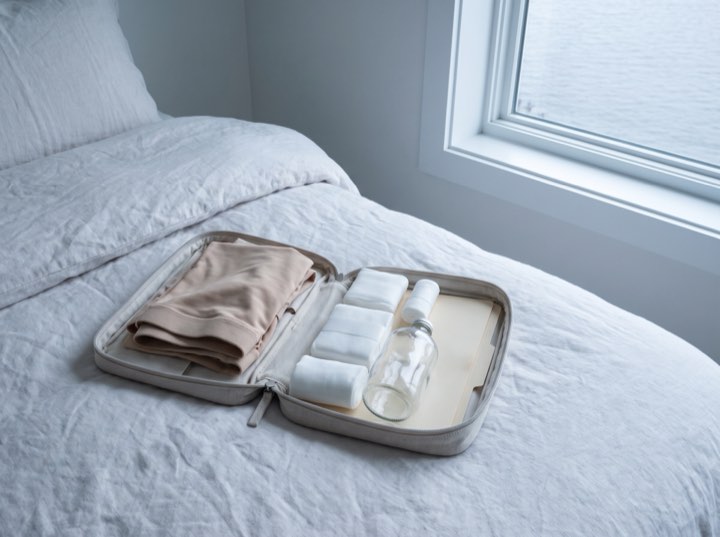 An aftercare kit laid out on white linen