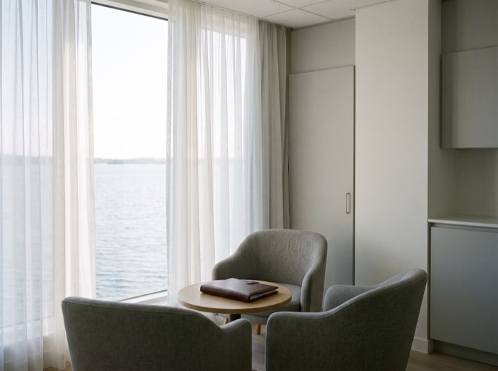 The consultation room, two chairs and a small table by the window