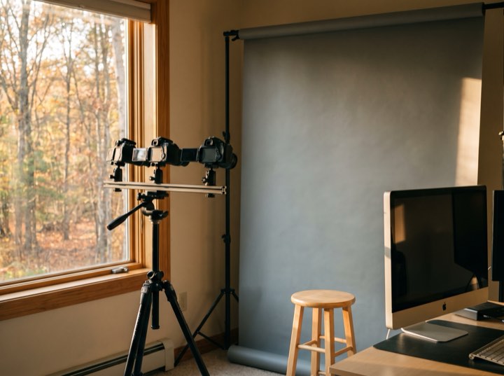 The imaging room: a camera on a tripod facing a grey backdrop