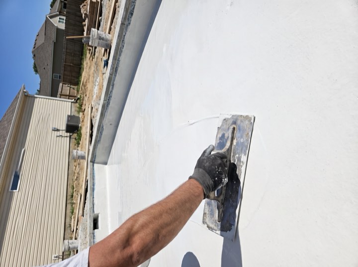 Plaster, trowelled by hand